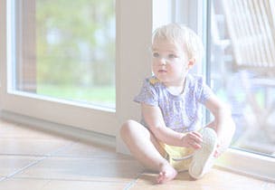 toddler sitting on the floor