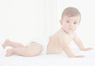 baby in nappy crawling