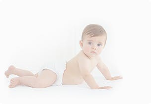 baby in nappy crawling